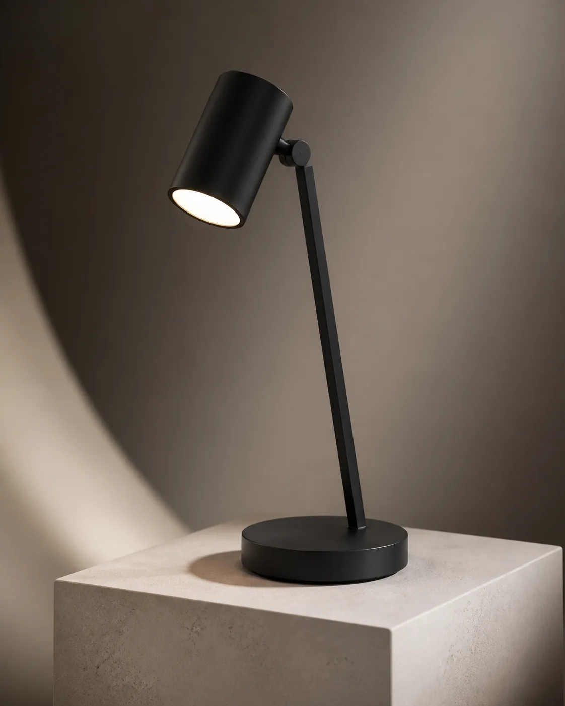 3D render AI prompt real output: Premium 3D product render of a minimalist matte-black desk lamp on a pale stone pedestal, dr